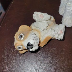 Dog Laying on its back figurine.